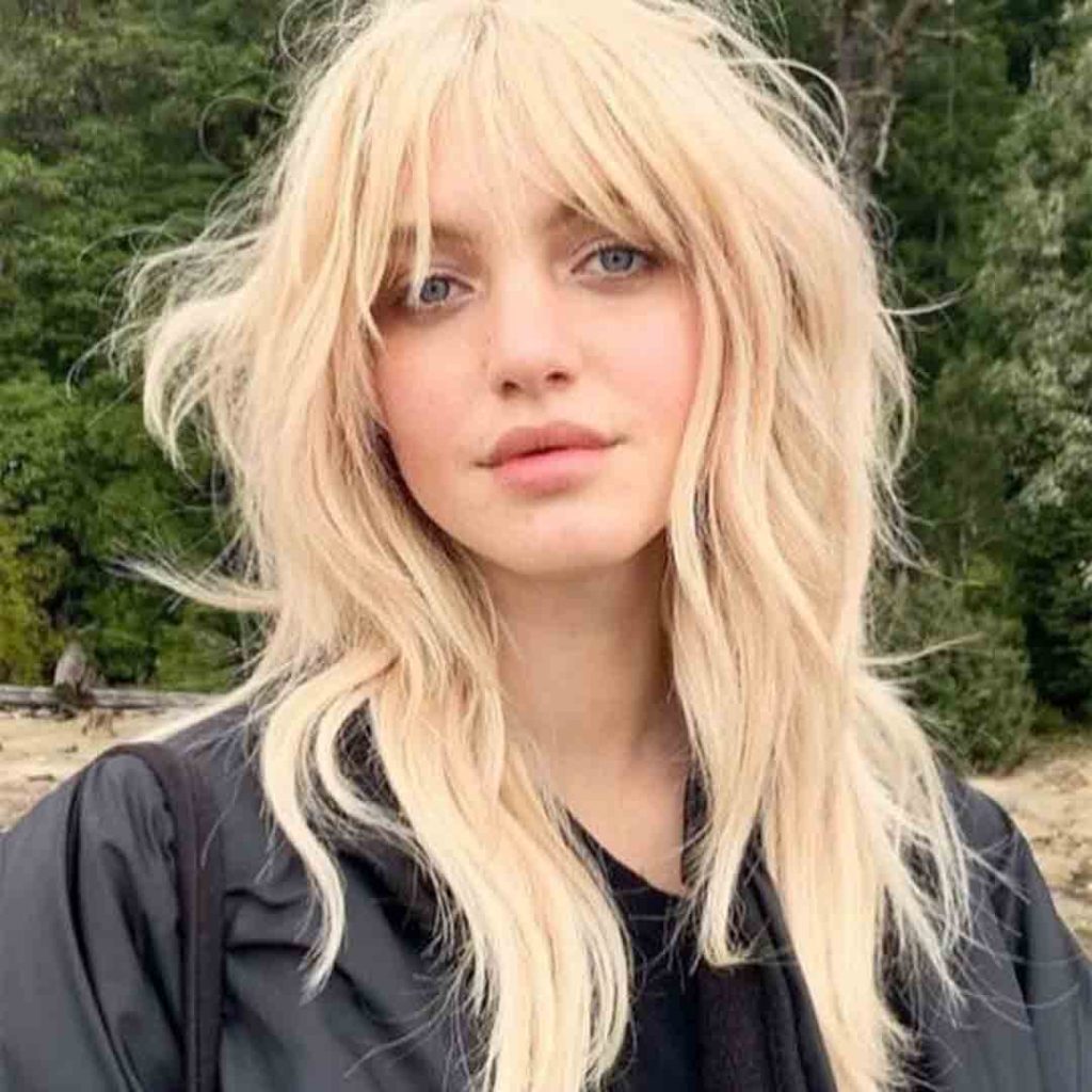 20 Best Fluffy Wolf Cut Ideas for Your Signature Style! 17 Bleach-Blonde Octopus Wolf Cut With Wispy Bangs