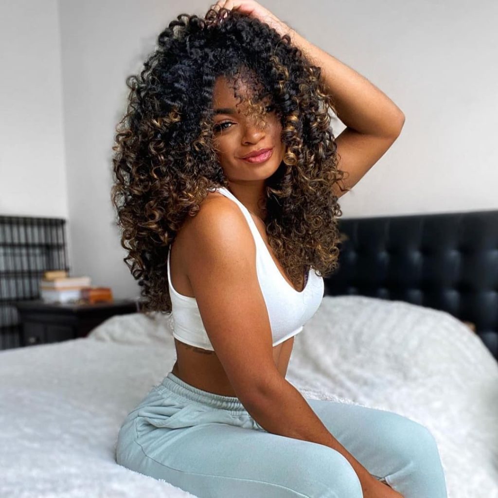 30 Best Curly Wolf Cut Ideas to Showcase Your Beautiful Curls 18 Long Curly Rezo Wolf Cut with No Bangs