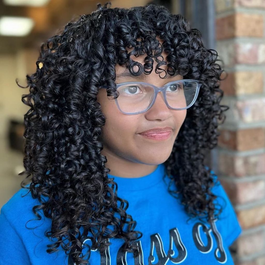 30 Best Curly Wolf Cut Ideas to Showcase Your Beautiful Curls 19 Medium Length Wolf Cut with Curly Twirls