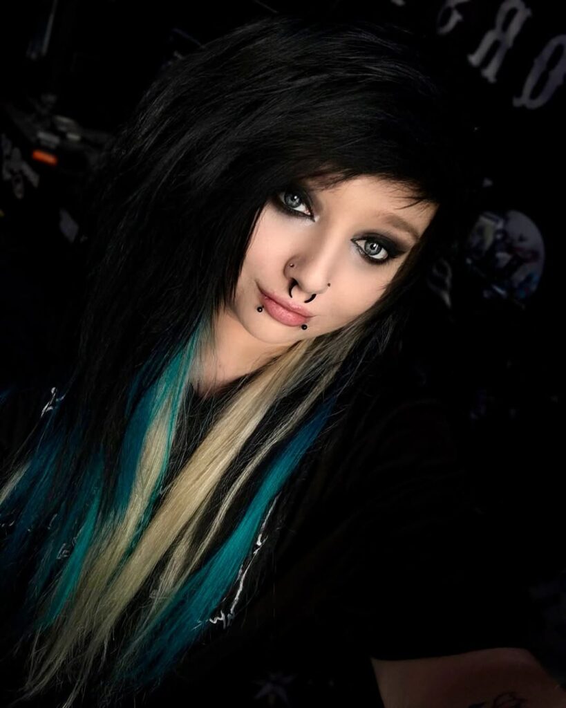12 Emo Scene Hairstyles for a Throwback 2 2. Black Emo Cut With Blonde Blue Highlights
