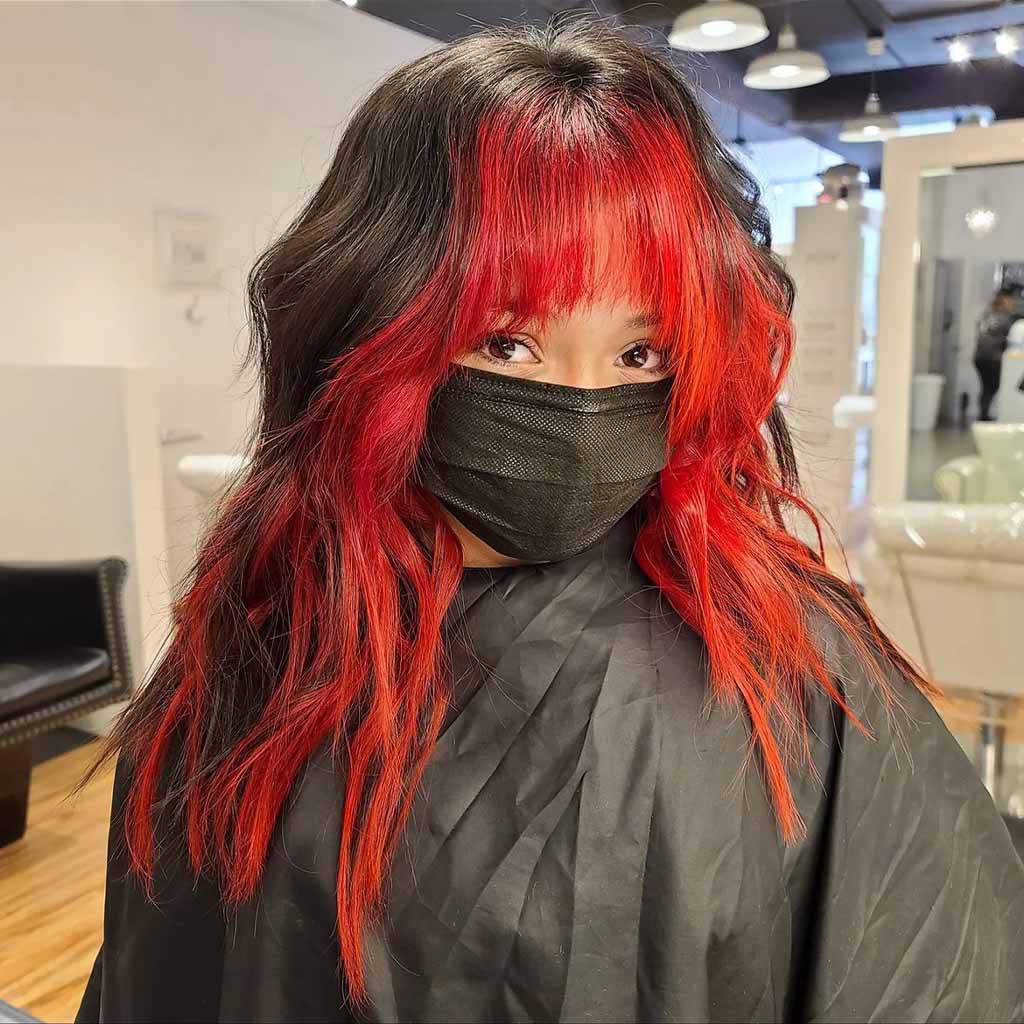 20 Best Fluffy Wolf Cut Ideas for Your Signature Style! 14 Fluffy Mullet Wolf Cut With Choppy Bangs, Subtle Waves and Red Highlights
