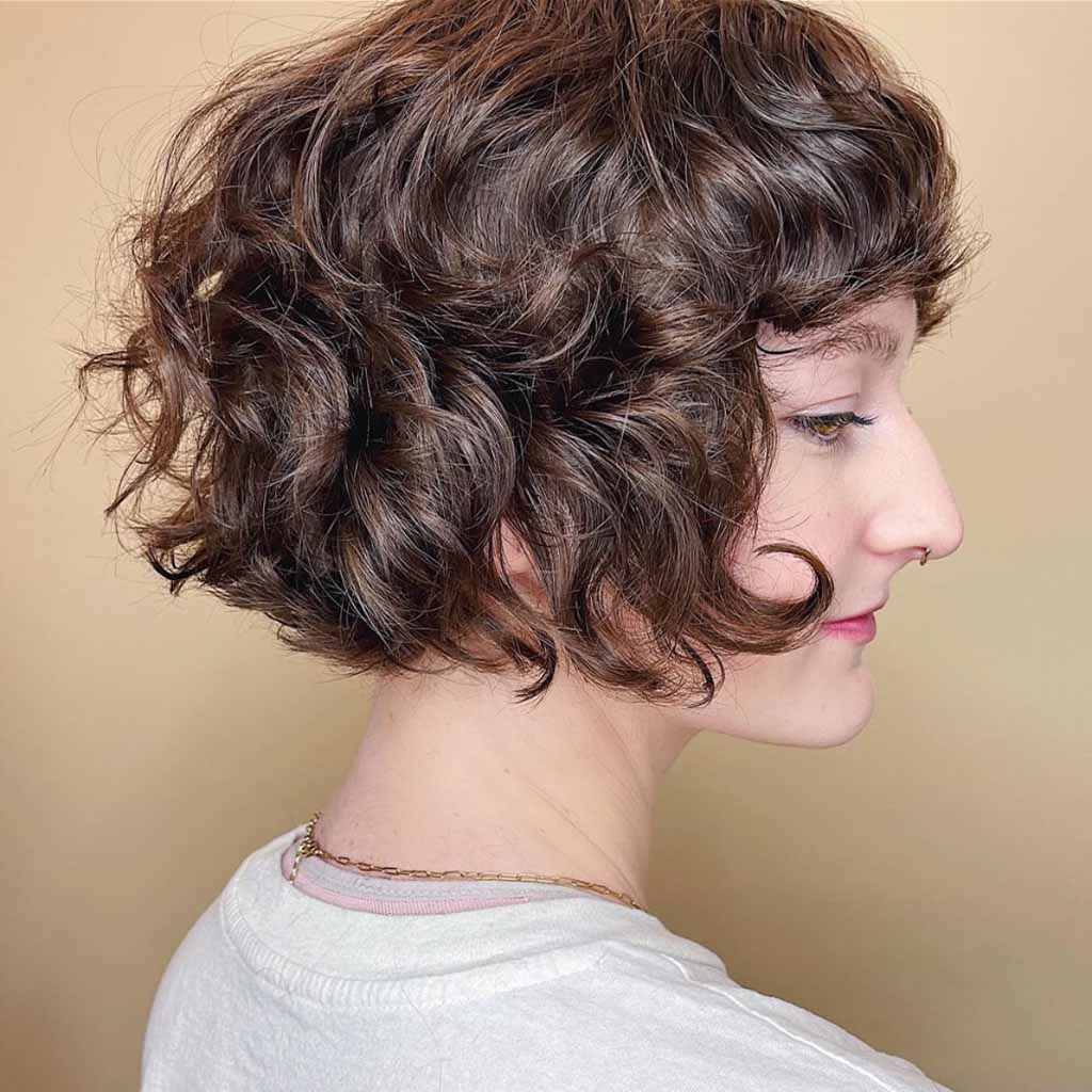 20 Best Fluffy Wolf Cut Ideas for Your Signature Style! 9 Curly Bob Cub Cut