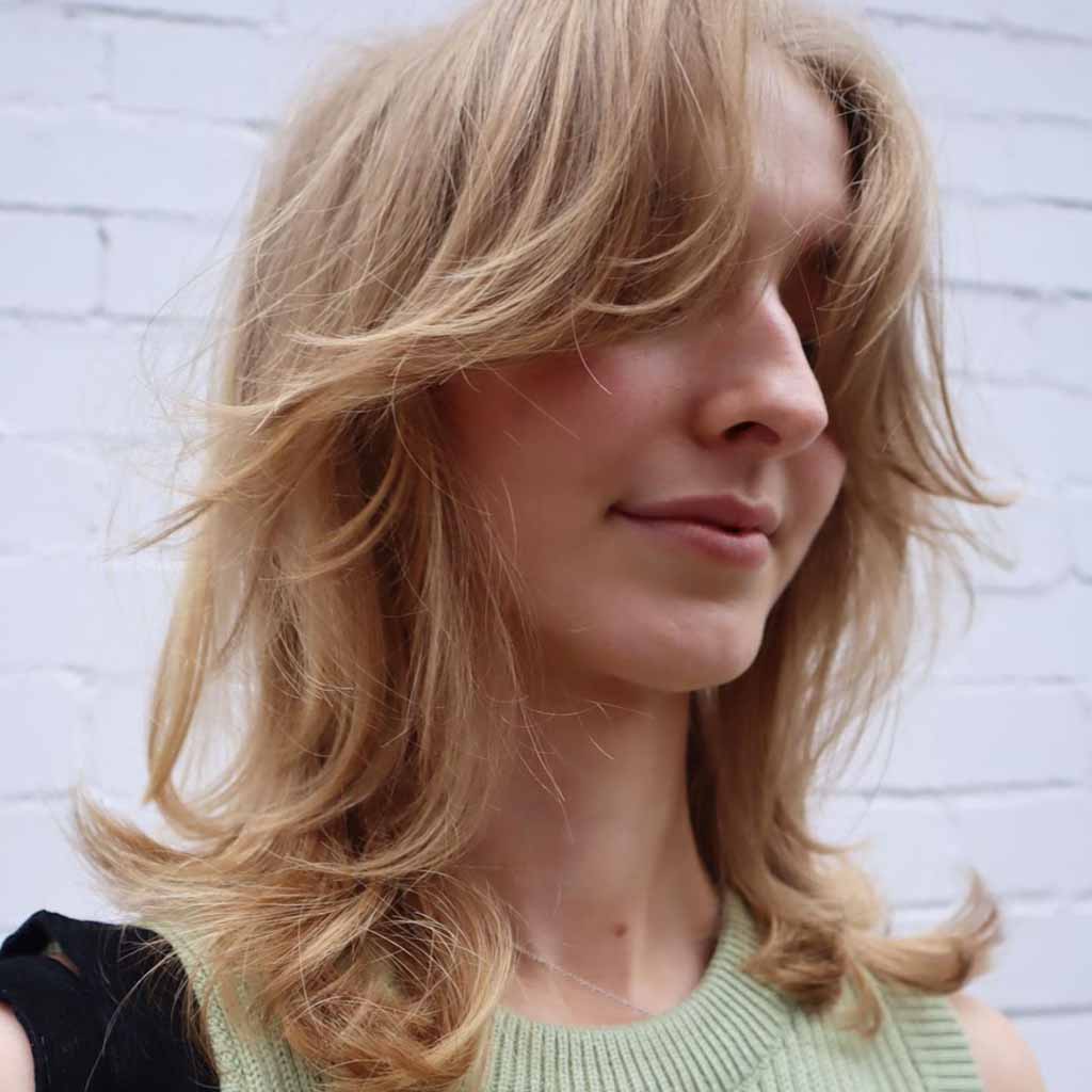 15 Best Wolf Cuts With Curtain Bangs 4 27 craphairclub