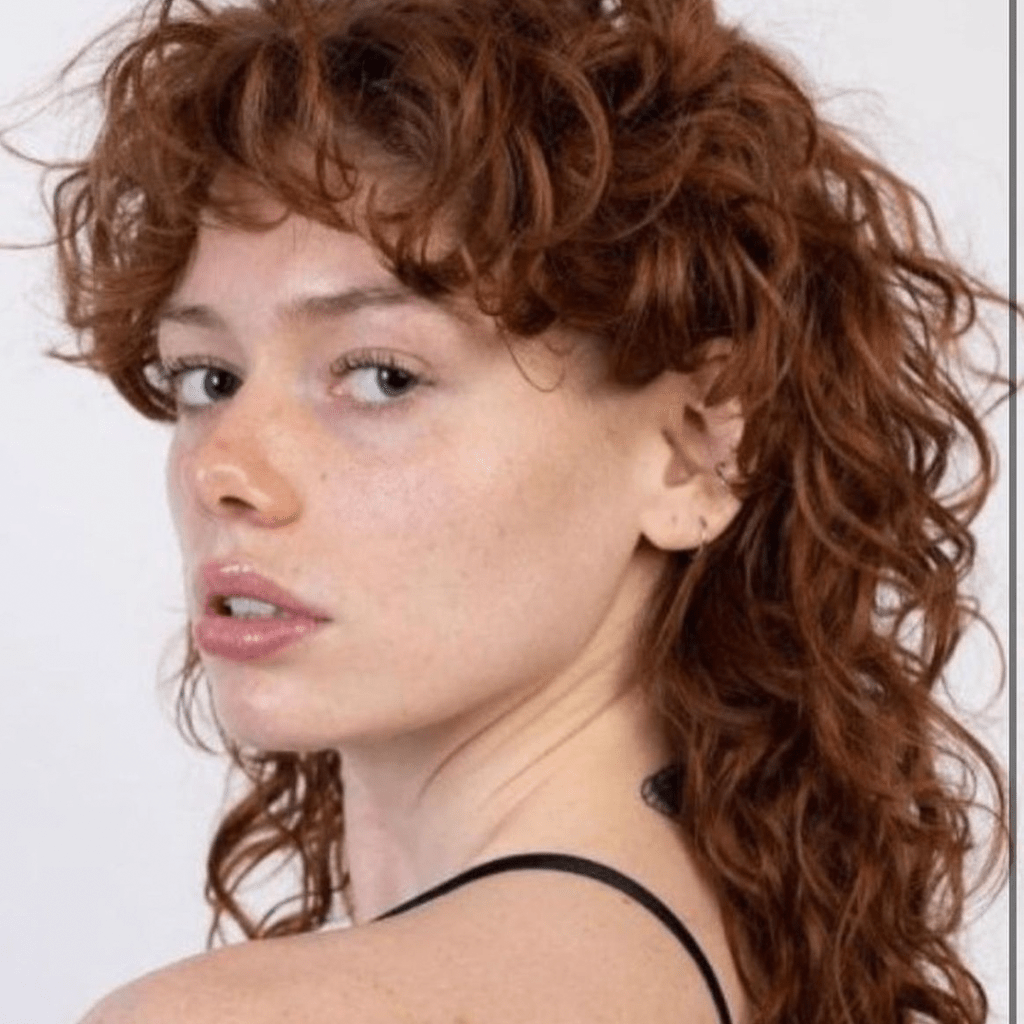 30 Best Curly Wolf Cut Ideas to Showcase Your Beautiful Curls 25 Ginger-Colored Mullet Wolf Cut on Long Curly Hair
