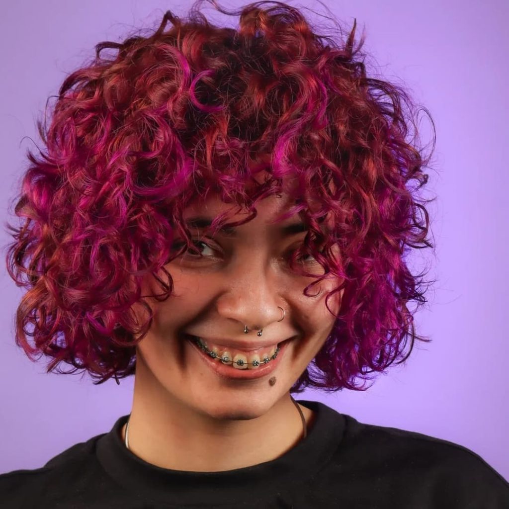 30 Best Curly Wolf Cut Ideas to Showcase Your Beautiful Curls 31 Short Wolf Cut on Purple Curly Hair
