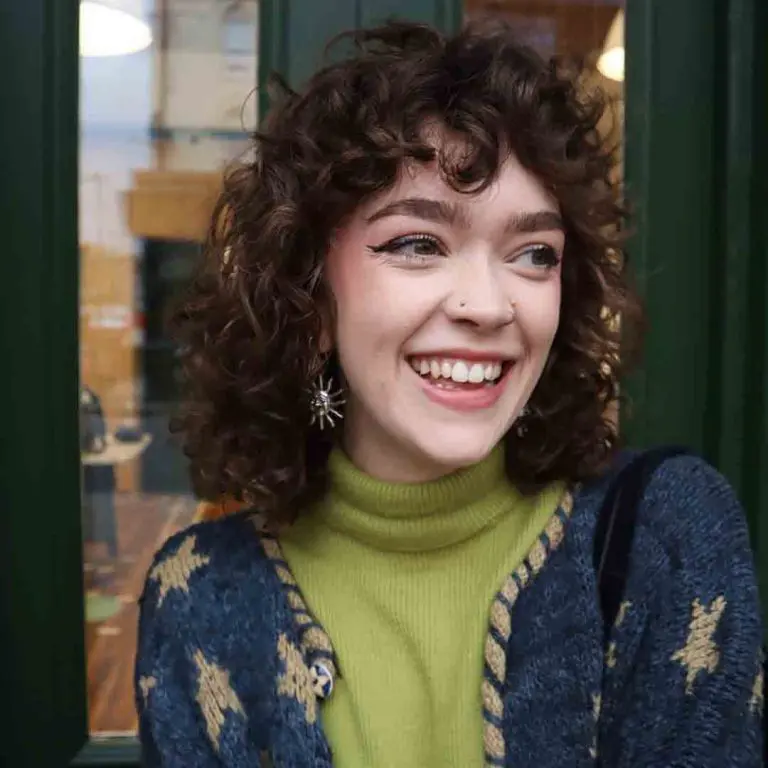 10 Classy Shaggy Wolf Cuts With Bangs 5 5. Curly Shag Wolf Cut With Short Curly Bangs 1