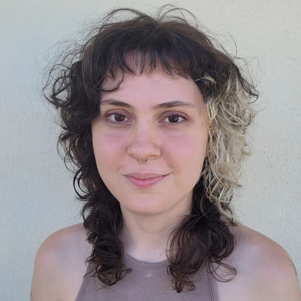 30 Best Curly Wolf Cut Ideas to Showcase Your Beautiful Curls 6 Duo Tone Wolf Cut With Short Bangs