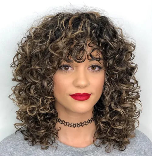 10 Latest Hairstyles for Naturally Curly Hair 7 7. Mid Length Curly Hairstyle with Curly Bangs 1