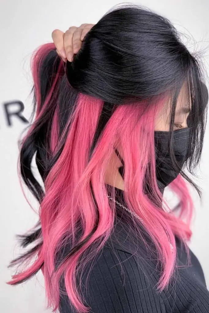 10 Sexy Hairstyles for Pink Hair 9 Black Wavy Hair With Pink Peek a Boo Highlights