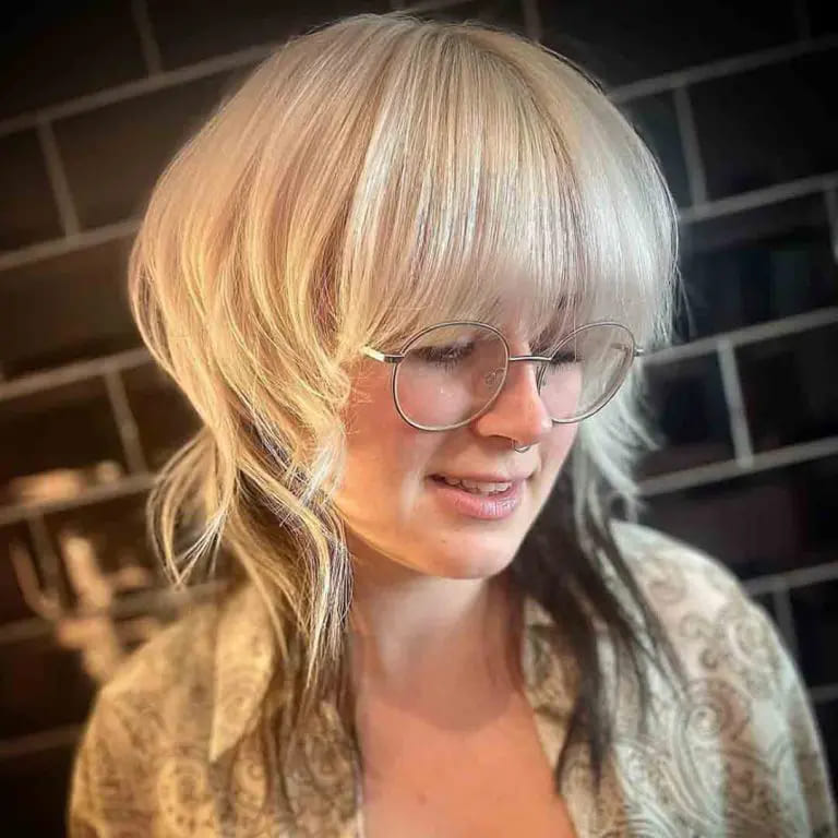 10 Blonde Wolf Cut Ideas For A Fresh Look 1 Blonde Mullet Wolf Cut With Long Bangs
