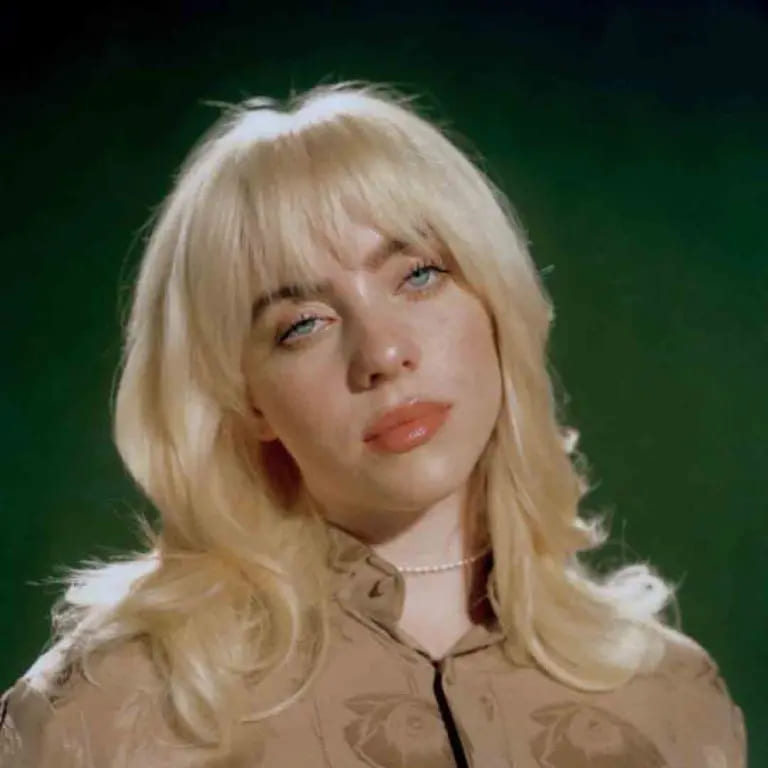 10 Blonde Wolf Cut Ideas For A Fresh Look 4 Blonde Wavy Wolf Cut With Bangs