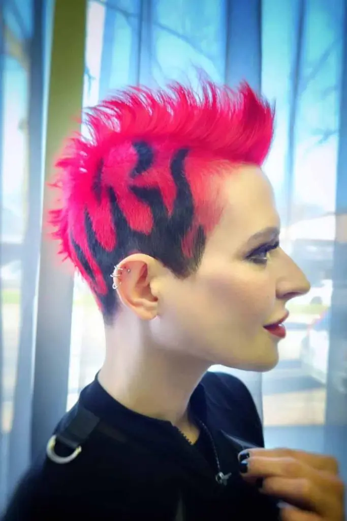 12 Bold Hair Dye Ideas for Women 1 Bright Pink Mohawk With Black Fire Pattern 1
