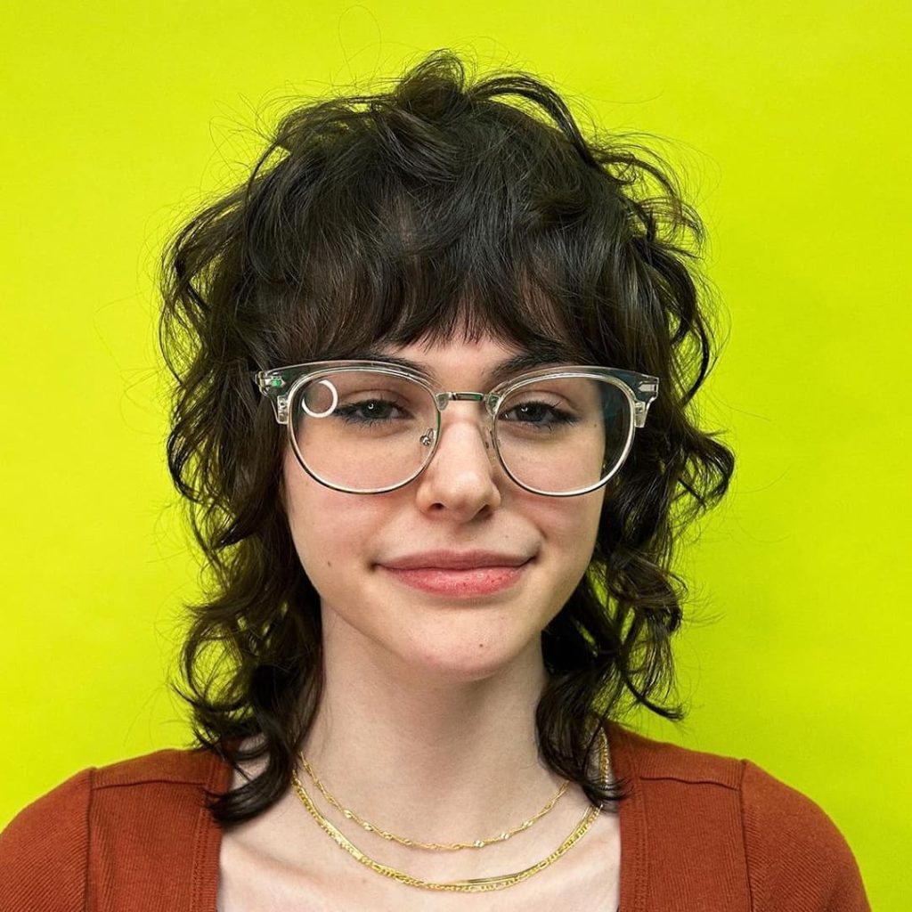 27 Best Wolf Cut Hairstyles for Women for All Hair Types, Lengths and Colors! 18 Curly Wolf Cut with Wispy Bangs olivethehairapist 1024x1024 1