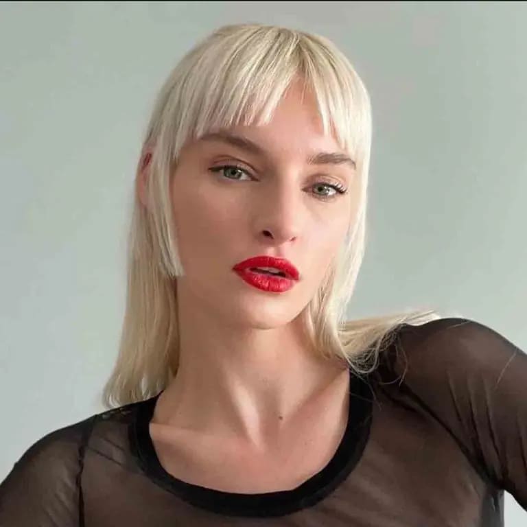 10 Blonde Wolf Cut Ideas For A Fresh Look 9 Frosty Blonde Wolf Cut With Bangs