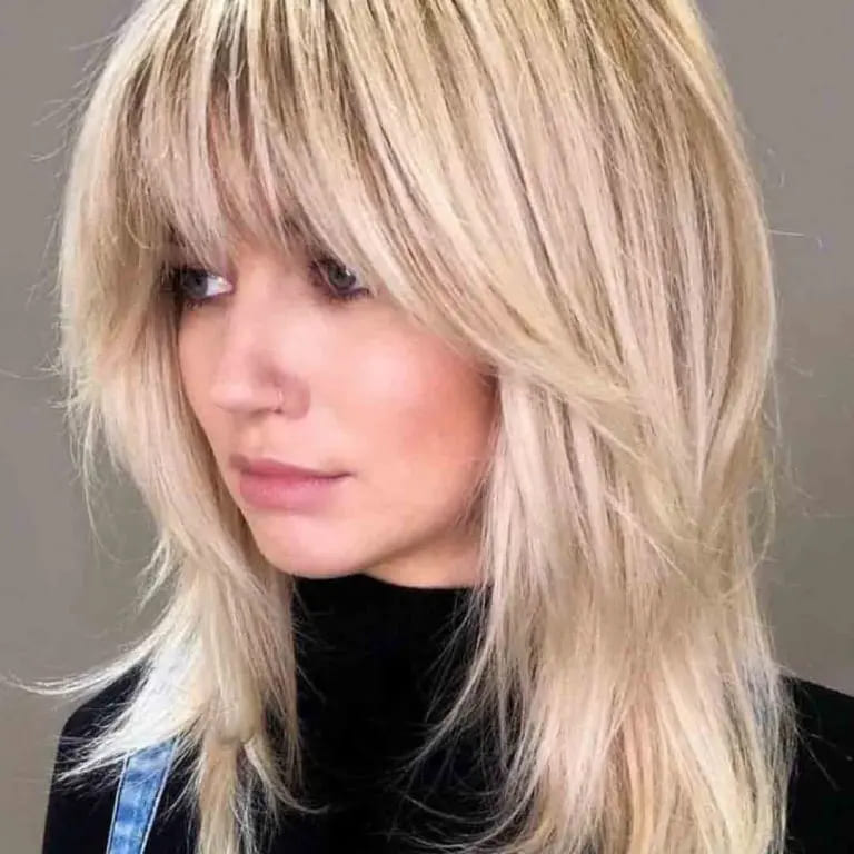10 Blonde Wolf Cut Ideas For A Fresh Look 10 Layered Blonde Wolf Cut With Choppy Bangs
