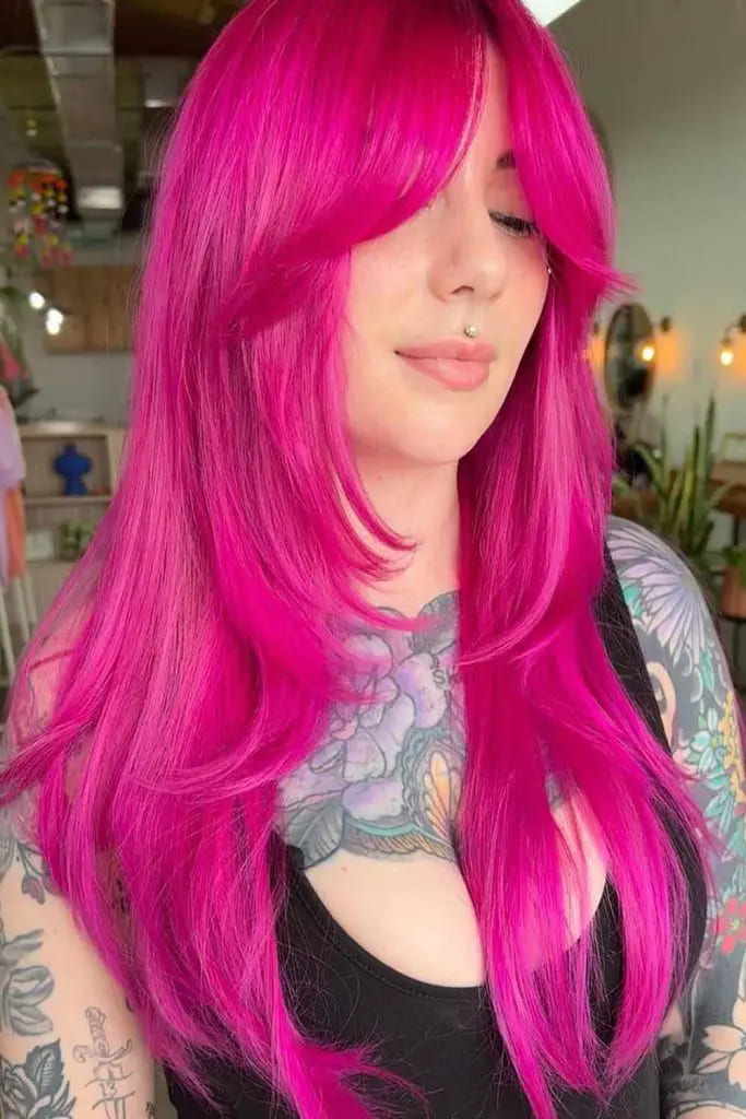 10 Sexy Hairstyles for Pink Hair 6 Long Hot Pink Layered Hair With Curtain Bangs