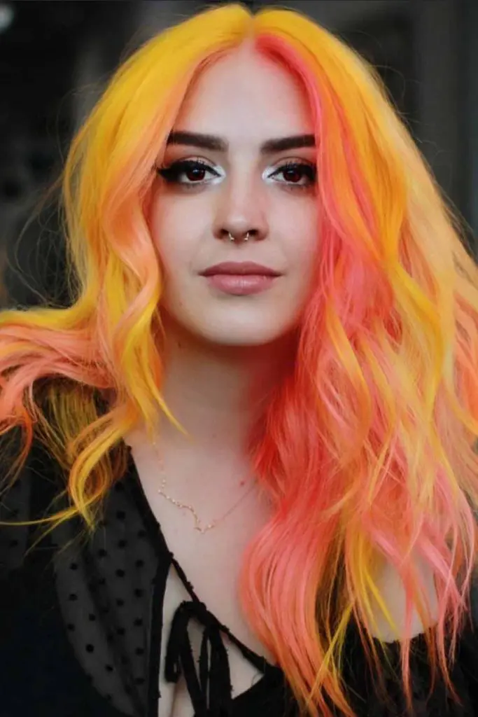 12 Bold Hair Dye Ideas for Women 5 Long Wavy Hair With Peachy Shades 1