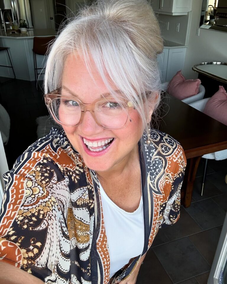 10 Hairstyles for Women Over 60 9 Loose Updo with Side Swept Bangs 768x960 1