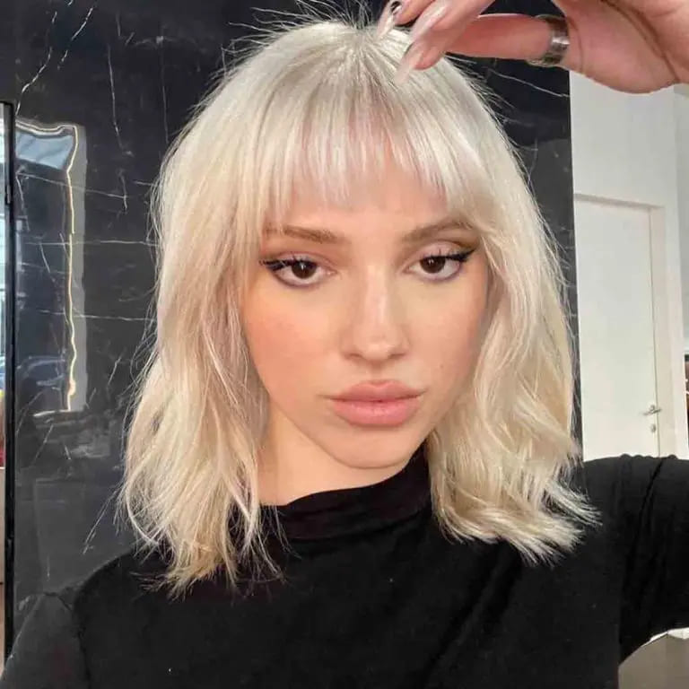 10 Blonde Wolf Cut Ideas For A Fresh Look 2 Medium Wolf Cut With Choppy Bangs