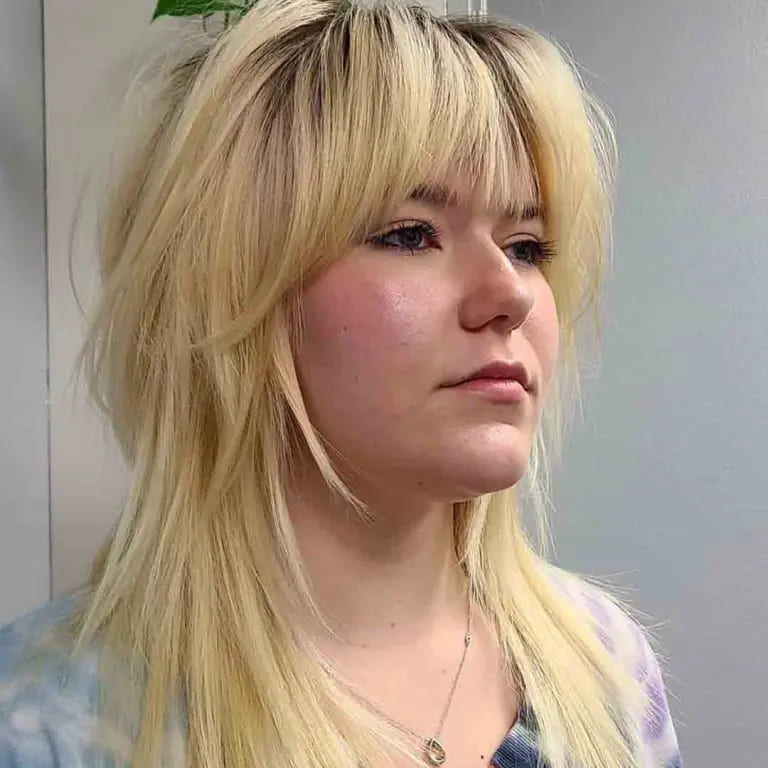 10 Blonde Wolf Cut Ideas For A Fresh Look 7 Shag Mullet Blonde Wolf Cut Side Swept Bangs