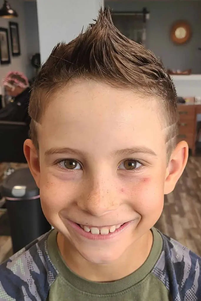 12 Charming Haircuts for Boys 1 Taper Haircut With Custom Lines