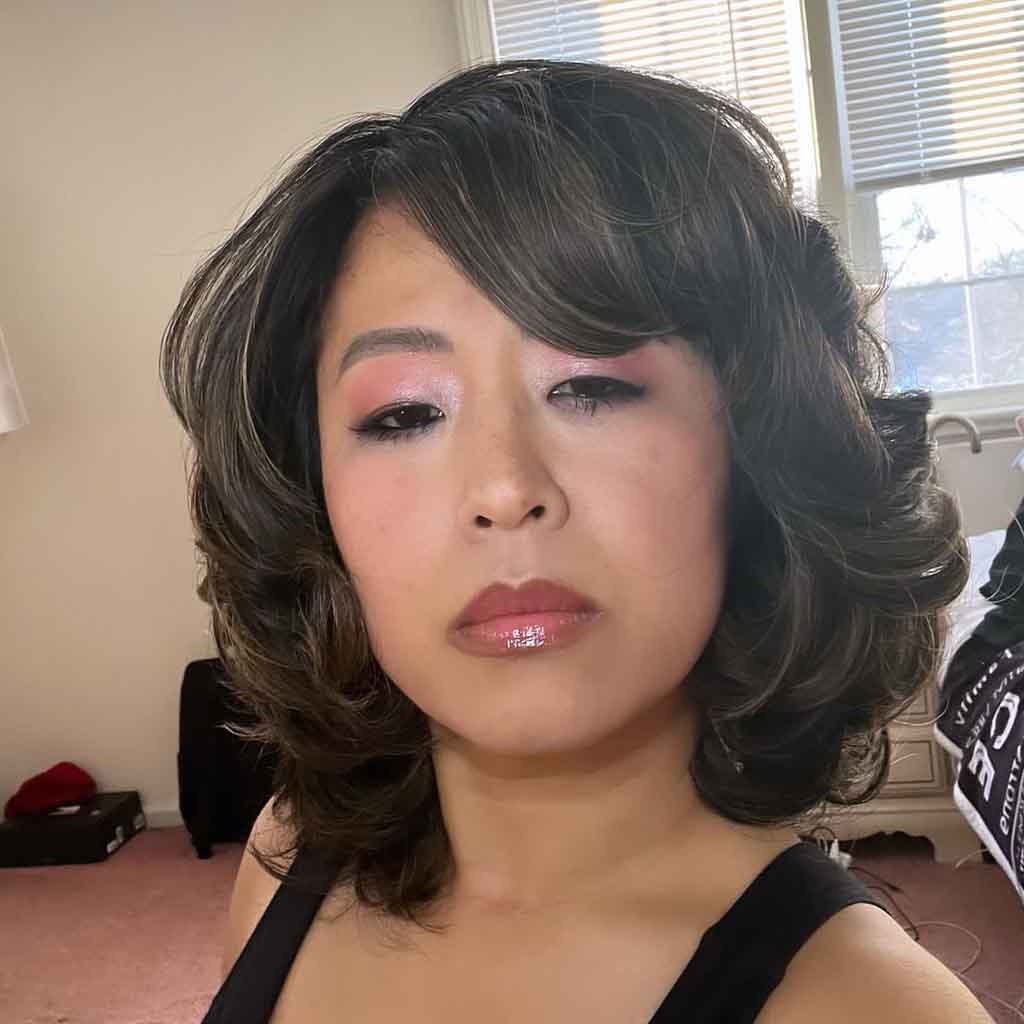 Medium Mob Wife Hair With Side-Swept Bangs