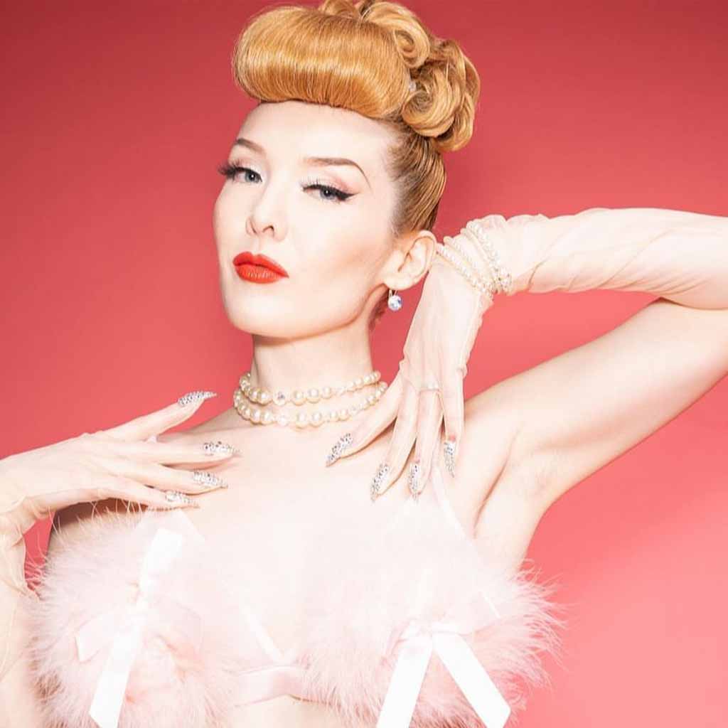 25 Classic Vintage Hairstyles to Go Retro! 7 Copper Hair Updo With Curls and High Curled Puff