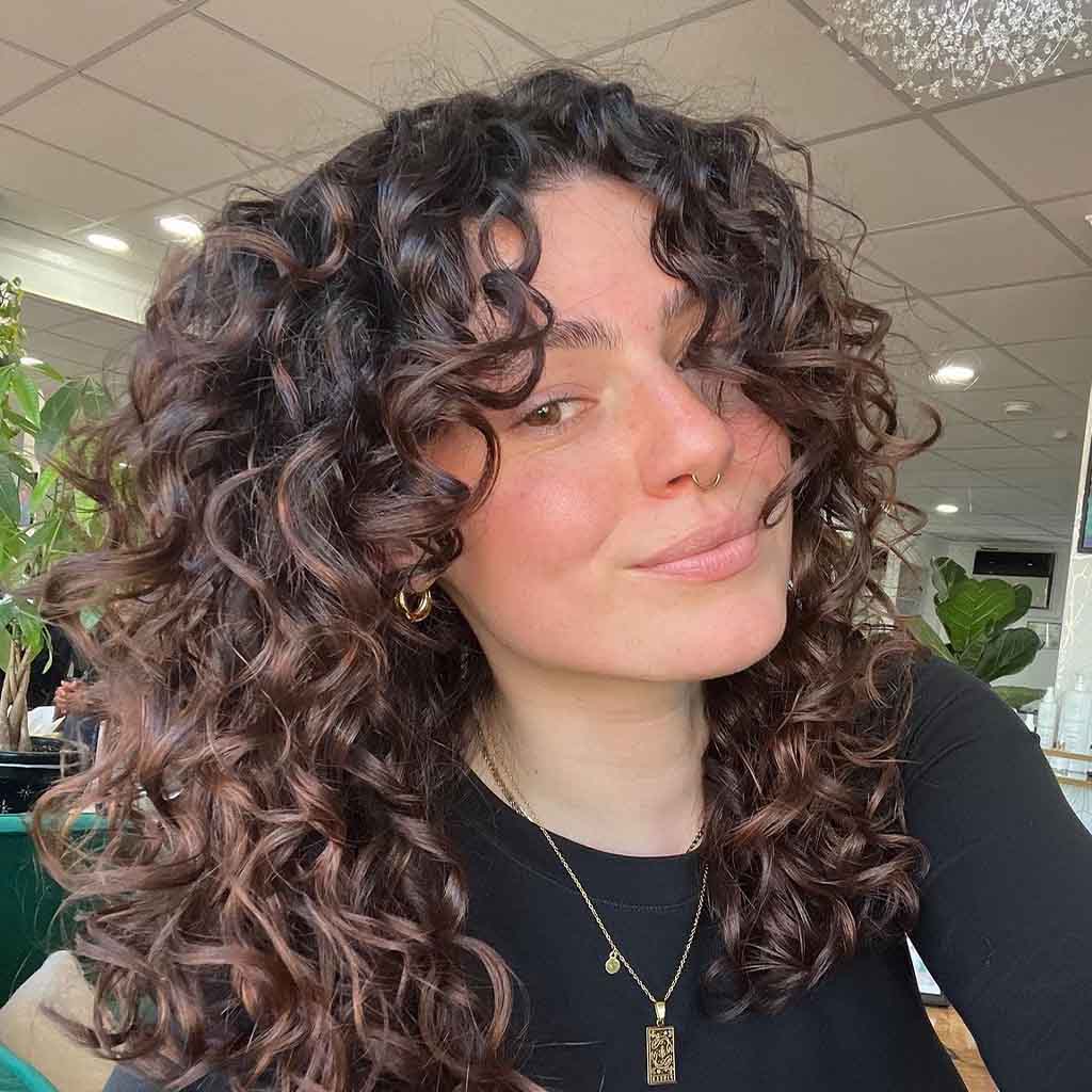 15 Fun Long Layered Hairstyles for Curly Hair! 11 Chocolate Brown Curly Hair With Face Framing Layers