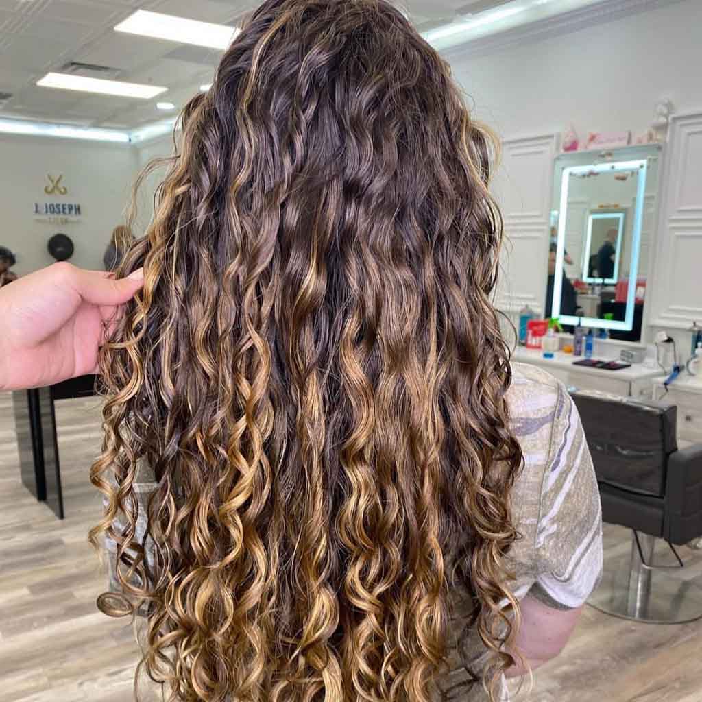 15 Fun Long Layered Hairstyles for Curly Hair! 14 Brown Layered Curly Hair With Blonde Highlights