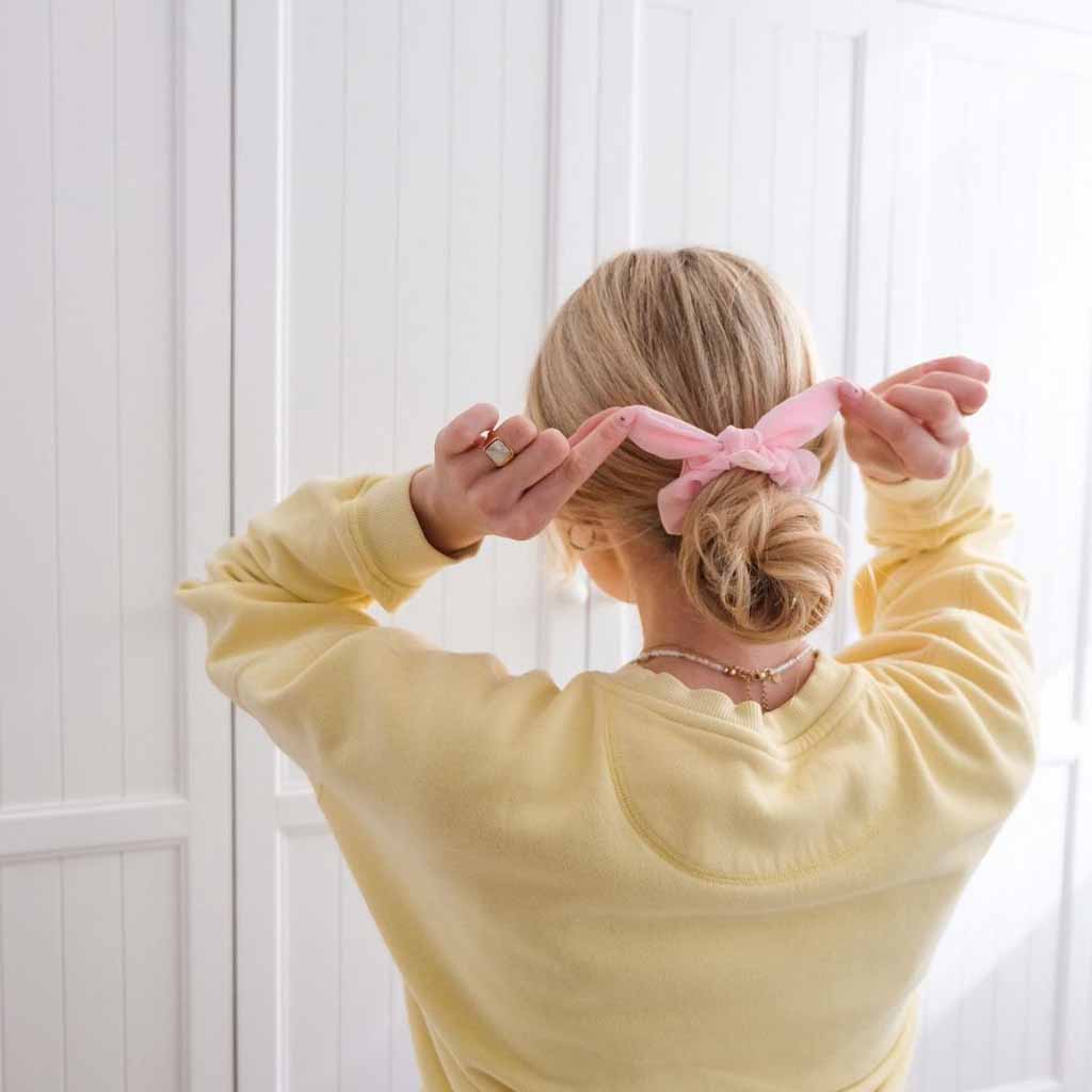 15 Beautiful Festive Easter Hairstyles! 15 Low Tousled Bun Styled With a Bow Scrunchie