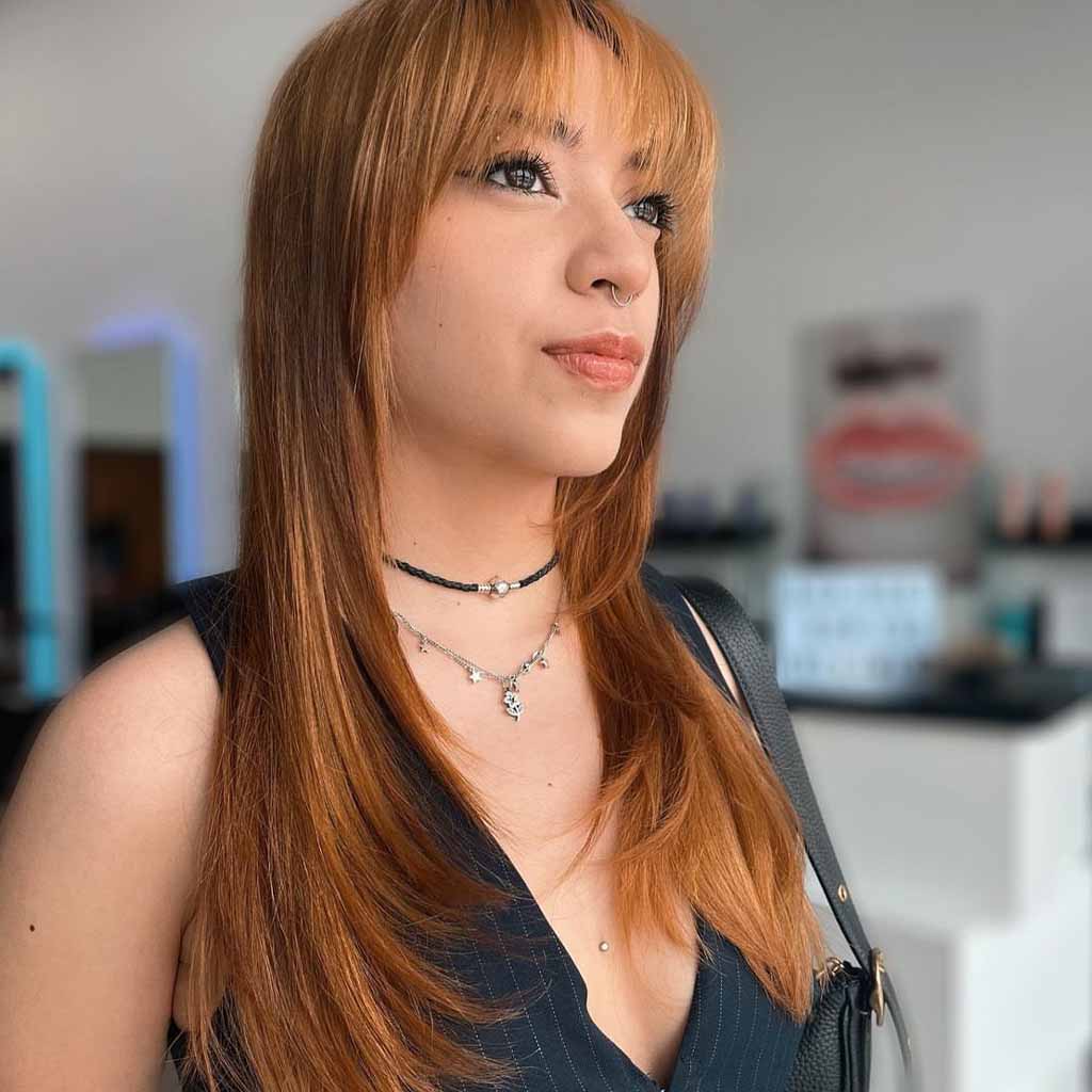 Long Copper Layered Hair With Wispy Bangs
