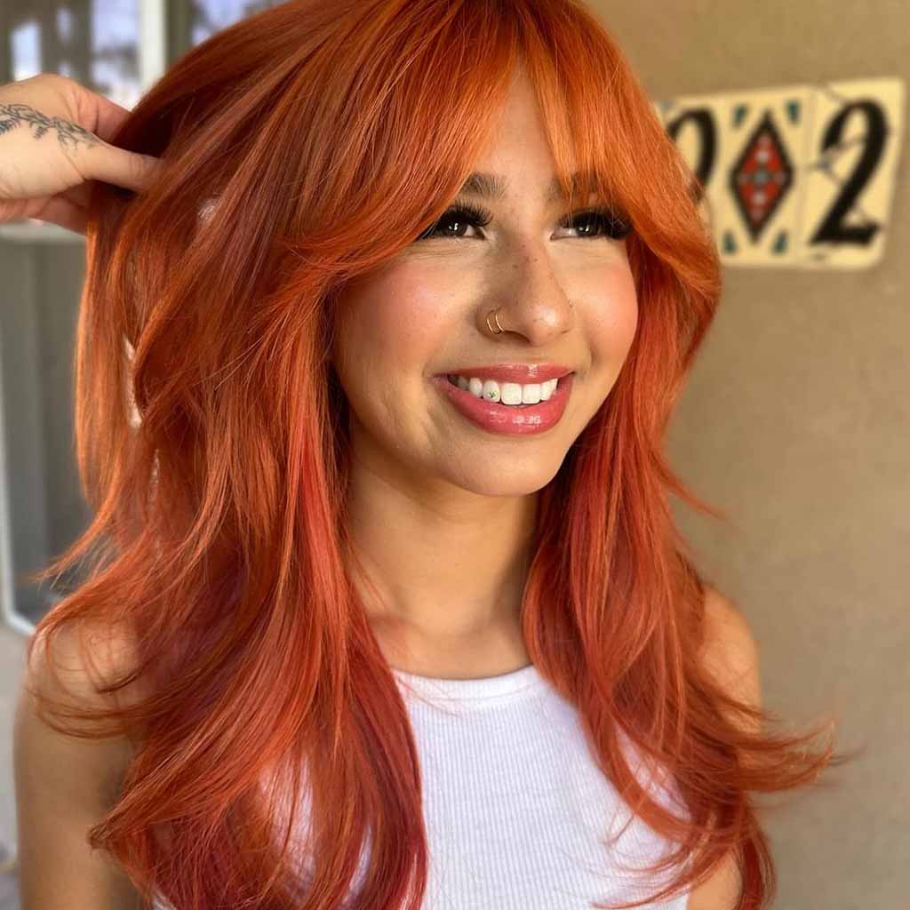 Ginger Layered Hair With Wispy Bangs