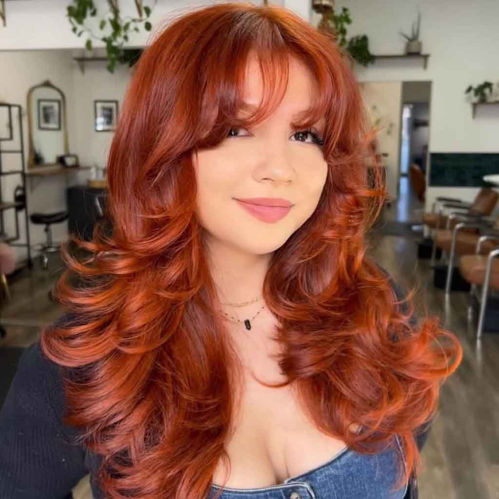 15 Retro 90s Blowout Hairstyles! 6 Copper Butterfly Blowout Hair With Curtain Bangs