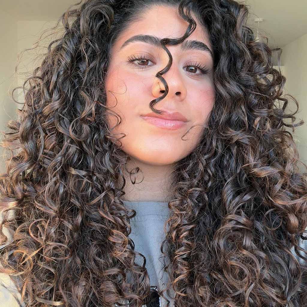 20 Playful Curly Hair Ideas! 10 Long Voluminous Bouncy Curls With Brown Balayage