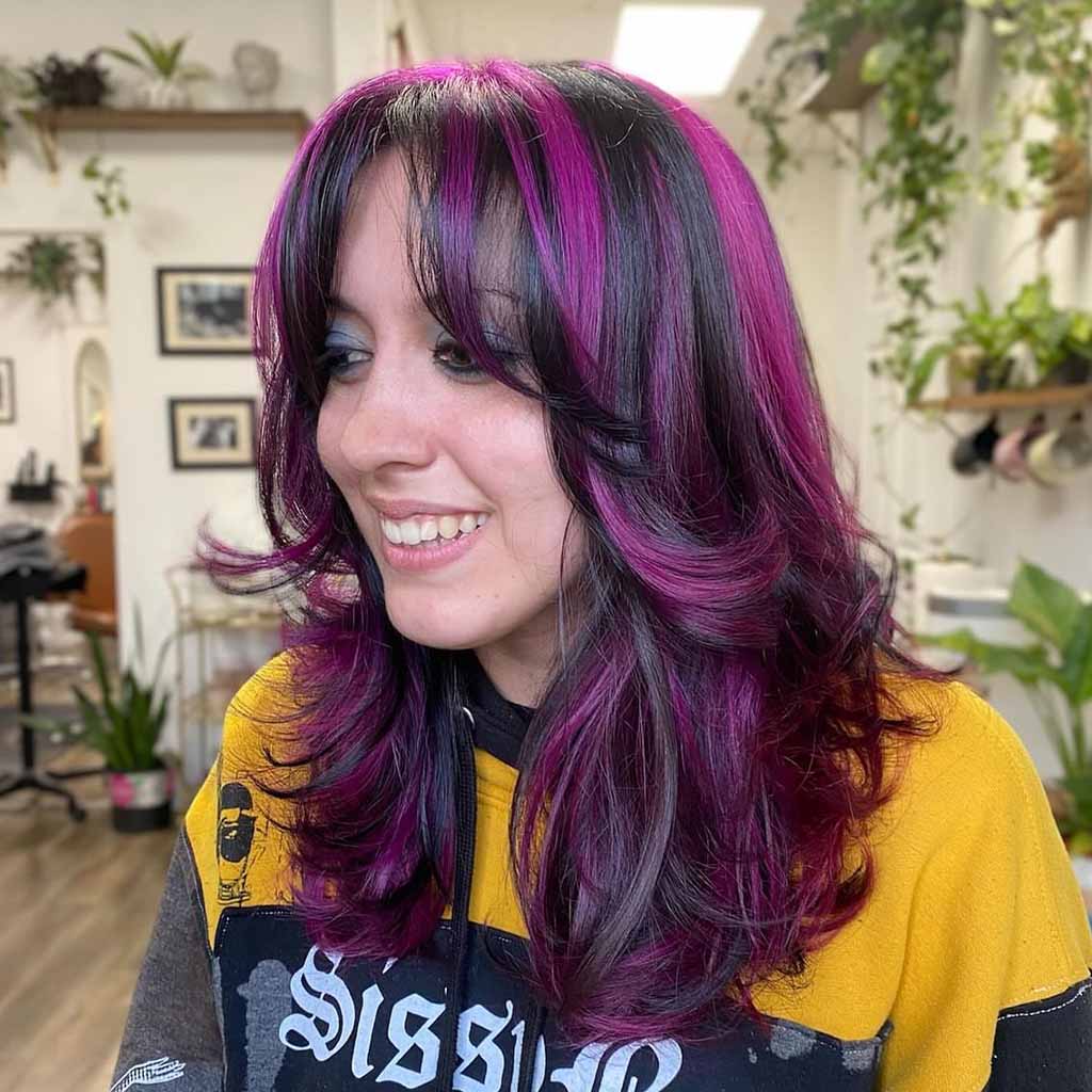 20 Stylish Hairstyles With Chunky Highlights! 11 Medium Layered Hair With Purple Highlights and Curtain Bangs
