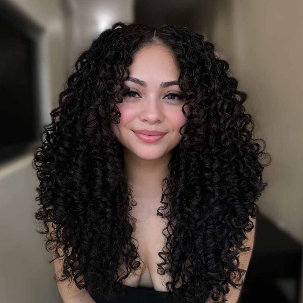 20 Playful Curly Hair Ideas! 12 Long Black Coiled Curls With Face-Framing Layers