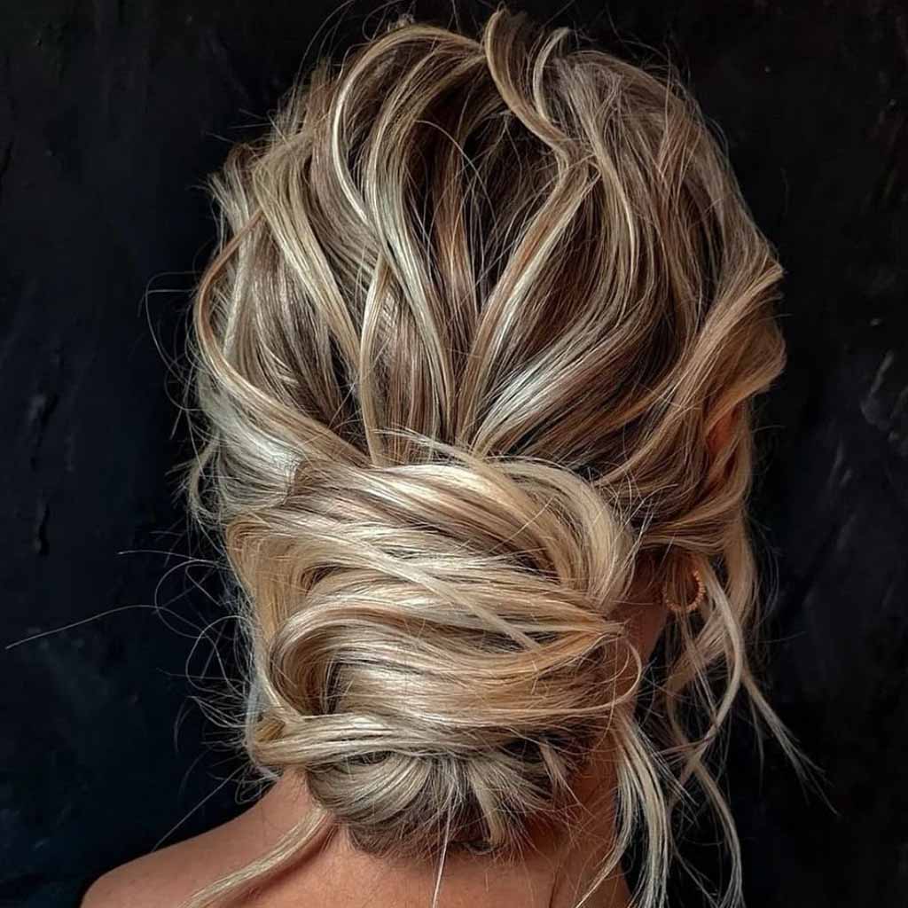 15 Stunning Bun Hairstyles for Elegance! 13 Bronde Textured Messy Updo Bun