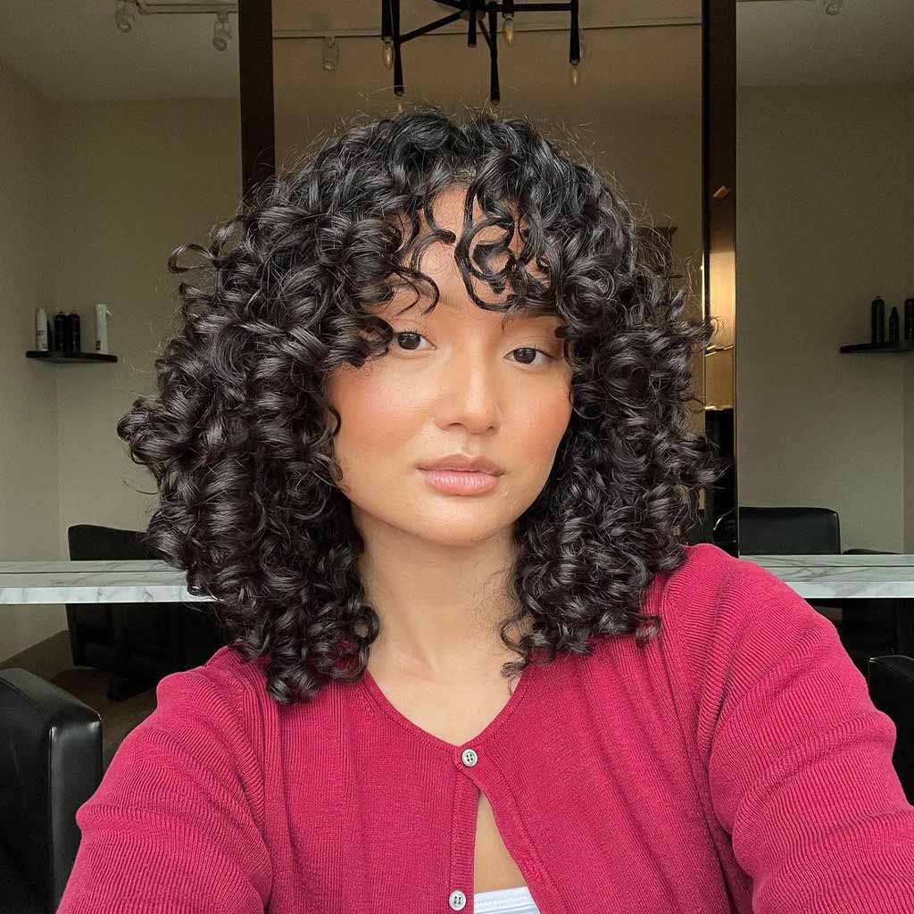 20 Playful Curly Hair Ideas! 14 Medium Black Curly Layered Hair With Bangs