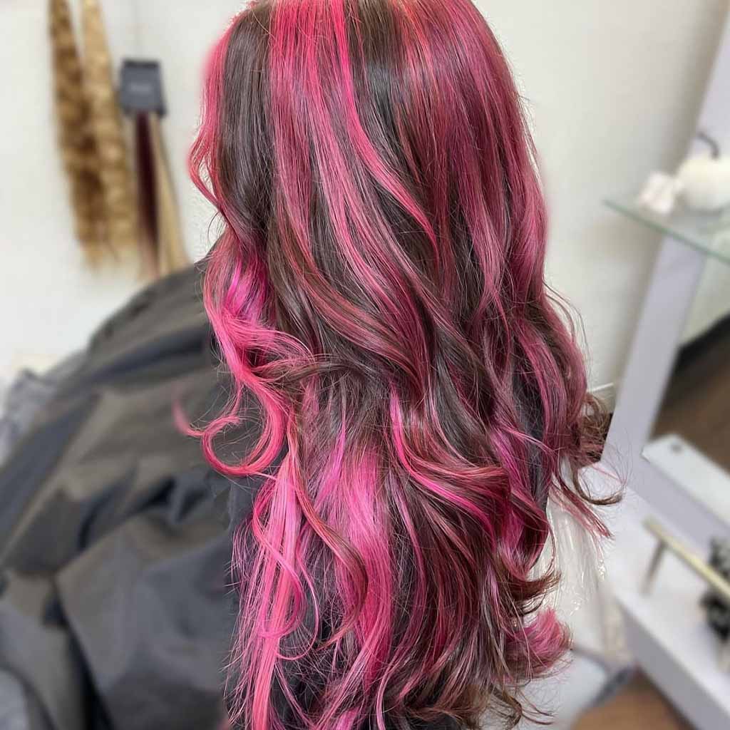 20 Stylish Hairstyles With Chunky Highlights! 19 Chunky Pink Highlights on Wavy Curly Long Hair