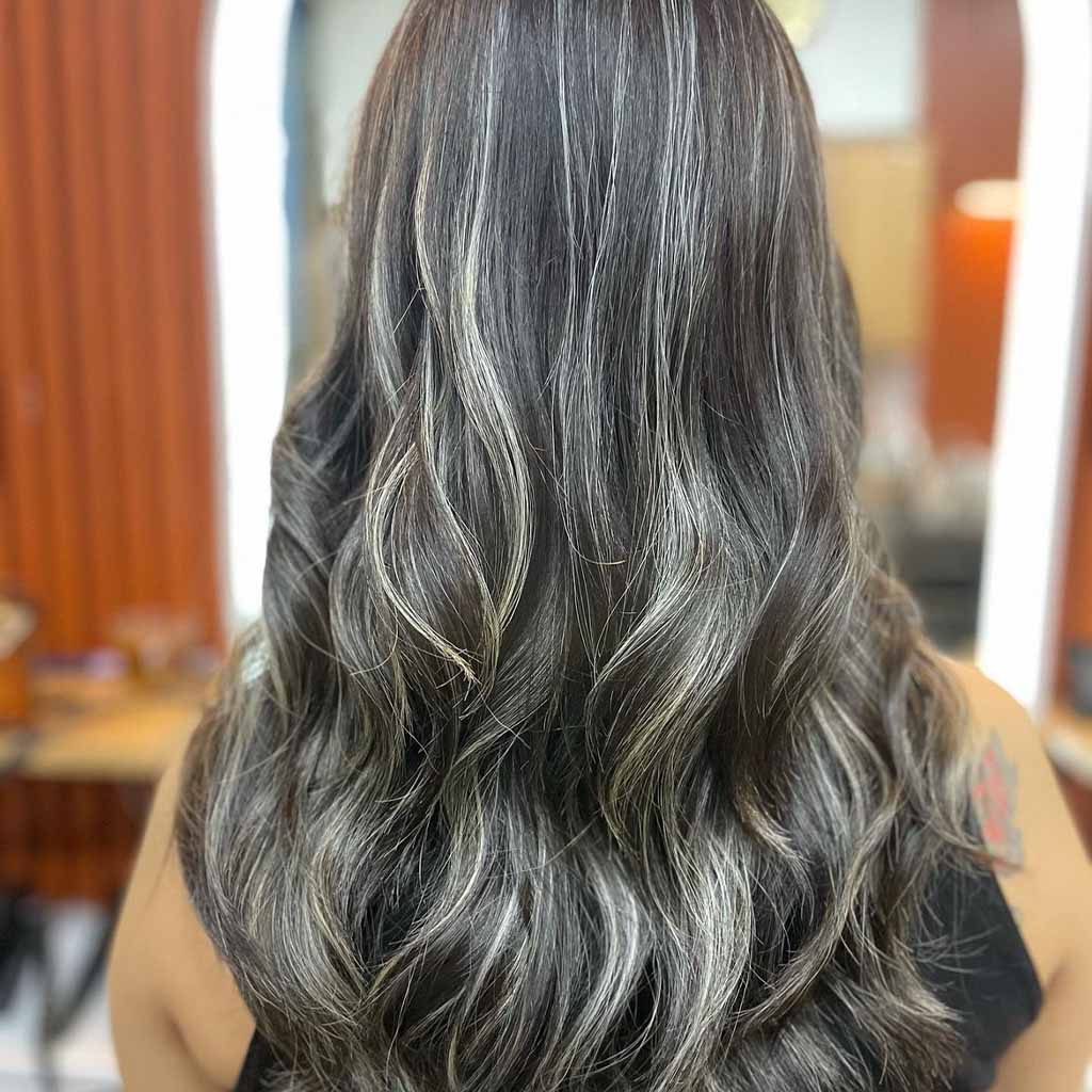 15 Sassy Hairstyles With Streaky Highlights! 9 Silver Streaky Highlights on Wavy Black Hair