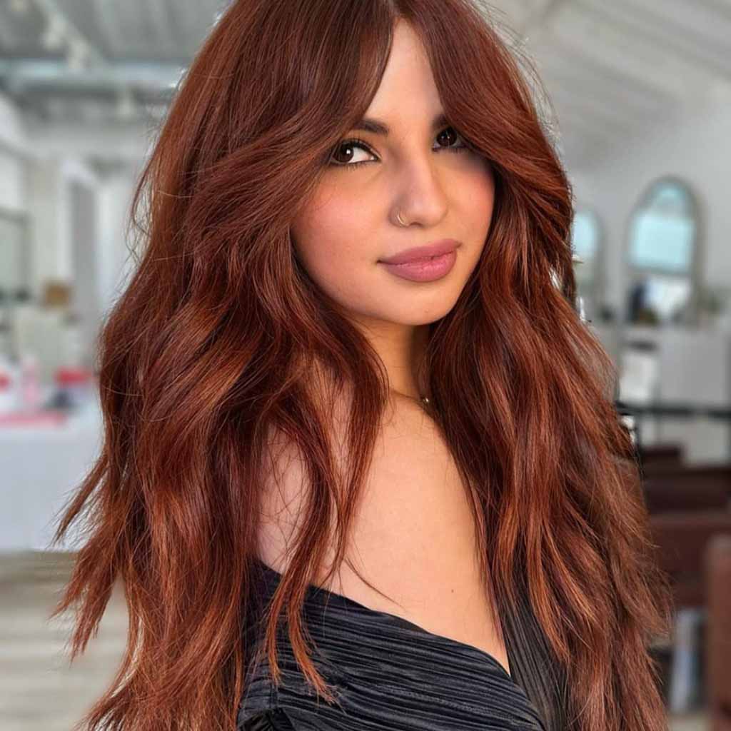 15 Spicy Hairstyles for Ginger Brown Hair! 2 Long Wavy Ginger Brown Hair With Extended Curtain Bangs