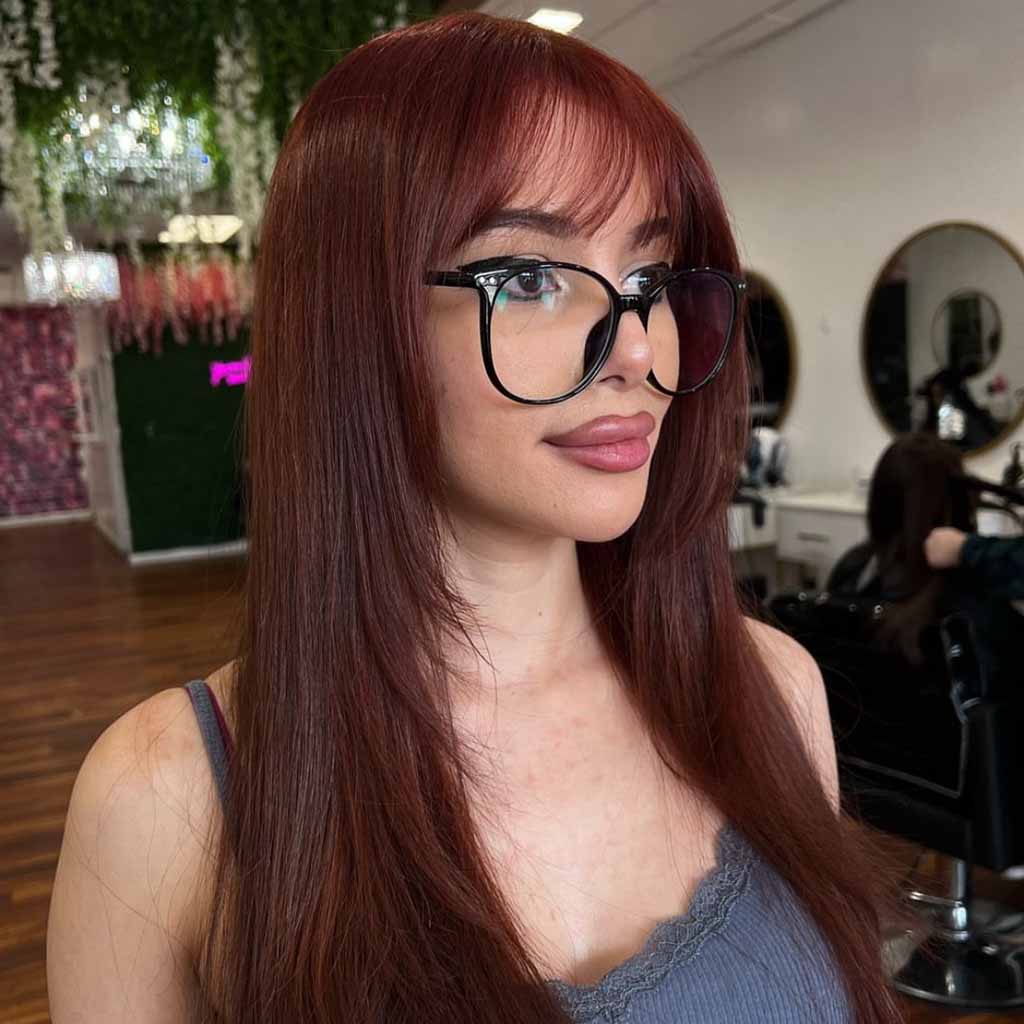 15 Spicy Hairstyles for Ginger Brown Hair! 12 Straight Layered Ginger Brown Hair With Wispy Bangs