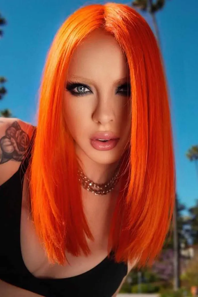 12 Bold Hair Dye Ideas for Women 4 Vibrant Fiery Orange on Straight Hair 1