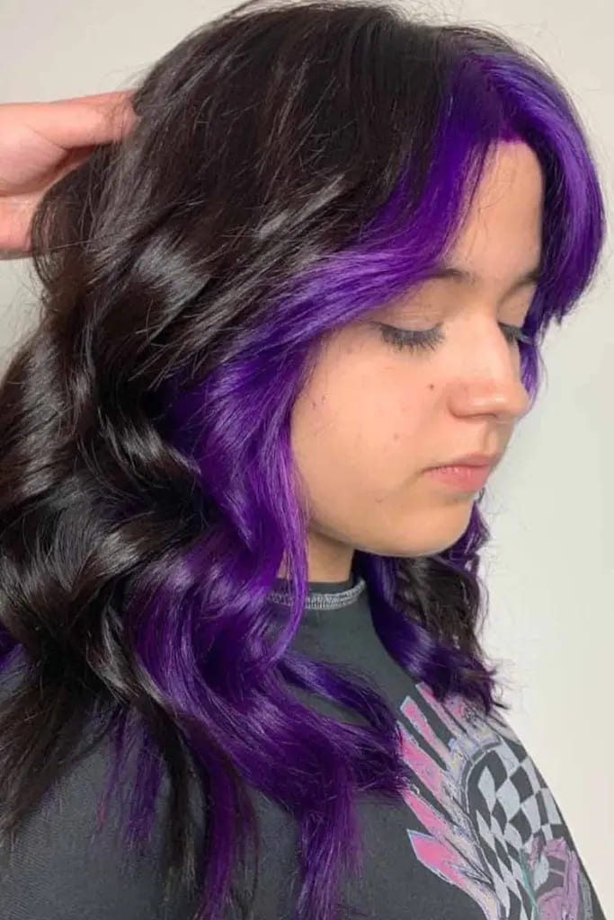 12 Vibrant Hairstyle Ideas for Purple Hair 4 Wavy Medium Layered Haircut With Purple Money Piece Highlight